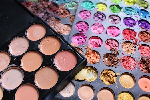 Close-up view of colorful makeup palettes with cracked pigments, ideal for beauty and cosmetics content.